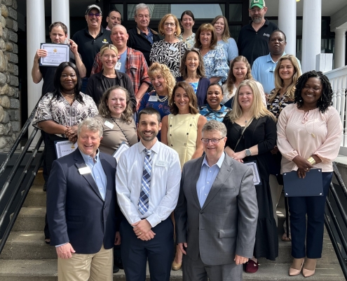 Smiling group photo of our 2025 honorees