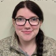 Allison Rivard, Accountant in the Oriol Health Care Business Office, smiling in front of a light-colored background. Recognized as October 2025 Employee of the Month for her attention to detail and collaboration.