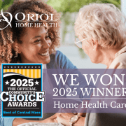 Caregiver smiling and holding hands with an older adult, with the Oriol Home Health logo and a badge announcing ‘We Won! 2025 Winner – Home Health Care’ for the Best of Central Massachusetts Awards.