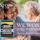 Caregiver smiling and holding hands with an older adult, with the Oriol Home Health logo and a badge announcing ‘We Won! 2025 Winner – Home Health Care’ for the Best of Central Massachusetts Awards.