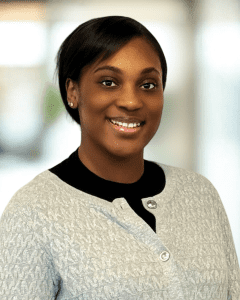 Oprah Boateng, Assistant Director of Nursing, smiling in professional headshot wearing a gray jacket