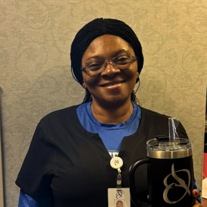 Judith Ejiofor, LPN | Holden Rehabilitation – October 2026 Employee of the Month Judith Ejiofor, LPN at Holden Rehabilitation & Skilled Nursing Center, smiling and holding her Employee of the Month recognition gift.